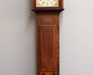 A mid 19th century Seth Thomas tall clock. 30-hour weight driven time and strike wooden movement with painted wood dial marker "S. Thomas, Plymouth". Pine case with the original Federal style painted decoration features a lift off hood with a broken arch crest and turned finials over an arched dial door flanked by simple square columns above the waist section with a rectangular molded door and a base with cut out feet. Original painted finish with wear and some touch-ups, replaced finials and hands, running momentarily when cataloged. 91 1/2" high overall.