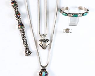 Five pieces of Sterling Silver jewelry. Includes an Asch Grossbardt necklace and bracelet with inlaid stones set in 18k Gold, a John Atencio heart pendant necklace with 18k Gold accents, a similar ring with 18k Gold and gemstone accents, and a Carmelita Simplicio Zuni cuff bracelet with Turquoise stones. Gemstone ring marked "PLAT / 950/ 18k", the others "925" or "Sterling" with "18k" and maker's marks. 4.10 troy ozs total. Some surface wear. Up to 24 1/2" long open.