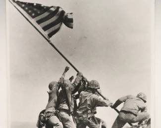 Joe Rosenthal, American, 1911-2006. A late 20th century silver gelatin photograph on Kodak paper, titled "Raising the Flag on Mt. Suribachi, Iwo Jima (1945)". Signed "Joe Rosenthal, A.P." lower left, paper back printed "This Paper Manufactured by Kodak" (used between 1973-1998) with a "Defense Dept. Photo (Marine Corps) / #113061" label verso. Minor creases and wear along edges. Unframed sheet 11 x 14" high overall.