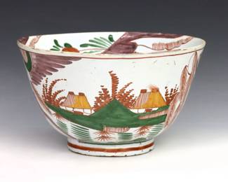 An 18th century Delft Earthenware bowl. Polychrome scenic decoration with fruit and floral detail. Monogrammed "VK". Some crazing and flakes. 10" diameter x 5 3/4" high.