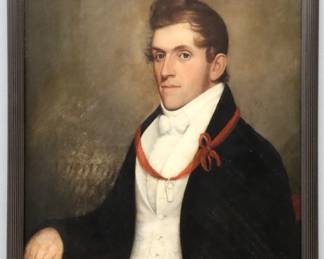 An early 19th century oil on board portrait of a young man. Depicted half length in dress attire with a Red ribbon bearing a Masonic Keystone emblem. Previous restorations with small areas of in-painting, nail hole at top center, slight shrinkage. Image 24 x 29 1/2" high, in a contemporary reeded wood frame, 26 3/4 x 32 1/2" high overall.
