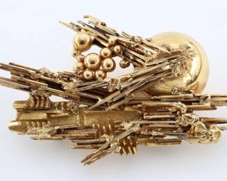 Arnaldo Pomodoro, Italian, b. 1926. A 1960's 18k Gold Brutalist style brooch. Signed "Arnaldo Pomodoro" and dated "66" on the reverse, presented in the original box. 51.1 grams total. Minor surface wear, one area with slight bend to ends. 3" long.