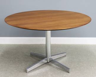 A Mid Mod Stow Davis dining table. Round Teak top on a Chrome pedestal base. Metal "Stow Davis" tag underside. Original finish with slight wear, minor water spots. 47 1/2" diameter x 28 1/2" high overall.
