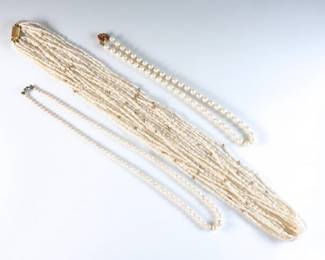 Three vintage Pearl necklaces. Two single strands with 14k Gold clasps and one multi-strand with Gold Filled beads and clasp. Some wear. Up to 28 1/2" long open.