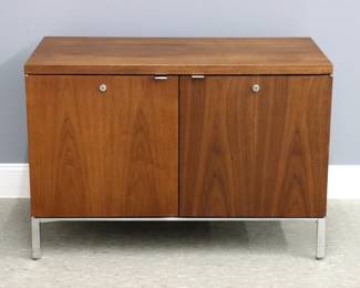 A Mid Mod Knoll style cabinet. Teak construction with two doors opening to a divided cabinet on a simple Chrome base. Original finish with minor wear, minor scratches and water spots to top. 38 x 20 x 26" high overall.