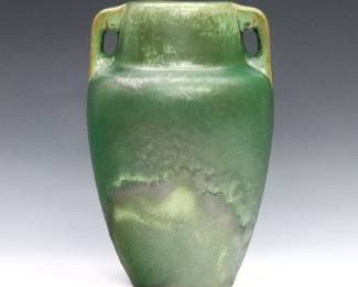 An early 20th century Fulper Pottery vase. Baluster form with two handles and Green drip glaze. Faint molded "Fulper" mark. Minor surface wear. 9" high.
