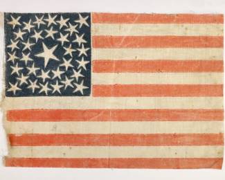 A mid 19th century American 33 Star parade flag celebrating Oregon's admission into the Union, c. 1859-1861. Printed cotton flag with raw edges features thirty-three White stars on a Blue canton in double medallion pattern with thirteen Red and White stripes. Some wear. 8 1/4 x 5 3/4" high overall.
