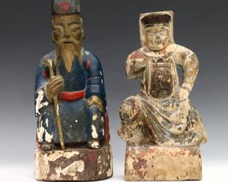 Two Chinese wooden reliquary figures. Carved seated figures with polychrome decoration and offering compartments at back. Wear and flaking, smaller lacks back panel. Up to 10 1/2" high.
