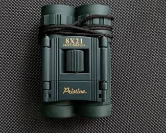 Another view of Pristine Optics 8x21 binoculars with carrying case