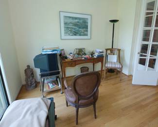 A figural Civil War soldiers sculpture by John Rogers; a TV on rolling cart; wooden console table, side chair, standing floor lamp, vintage padded side or desk chair
