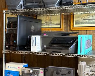 Bell & Howell projectors, Bell & Howell 671 XL Focus-matic movie camera, AIWA boombox, HP printer, computer keyboard, speakers