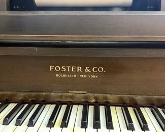Closeup of vintage Foster & Co. upright player piano