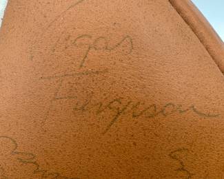 Closeup of 1977 Notre Dame Team Signed Football - includes signatures from Coach Dan Devine, players including Joe Montana, Bob Golic, Vagas Ferguson, Rusty Lisch, Dave Wagmer, Kris Haines and many more. Appears to hold +50 signatures.
