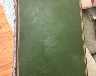 Another view of an antique illustrated 4-volume set of Pickwick Papers by Charles Dickens, published in 1887 by Chapman and Hall, London; inside pages attest "This edition is limited to 2,000 copies, in 500 of which the plates are printed on India paper."