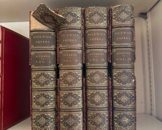 An antique illustrated 4-volume set of Pickwick Papers by Charles Dickens, published in 1887 by Chapman and Hall, London; inside pages attest "This edition is limited to 2,000 copies, in 500 of which the plates are printed on India paper."
