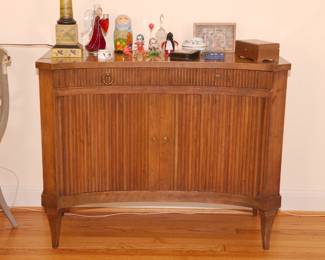 A fabulous Baker Furniture mid century modern curved front tambour doors fruitwood server