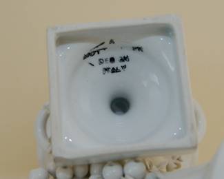 Underside of Mottahedeh decorative ceramic campagna urns with applied fruit, flowers, and handles, made in Italy