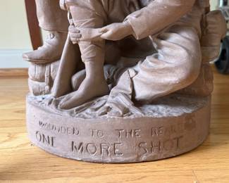 Closeup of John Rogers sculpture "Wounded to the rear. One more shot." statue of two Civil War soldiers