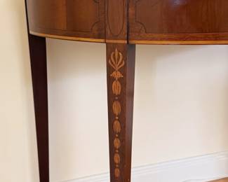 Closeup of pair of beautiful Hepplewhite style demilune folding game tables with felt