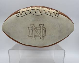 1977 Notre Dame Team Signed Football - includes signatures from Coach Dan Devine, players including Joe Montana, Bob Golic, Vagas Ferguson, Rusty Lisch, Dave Wagmer, Kris Haines and many more. Appears to hold +50 signatures.