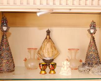 Tall pair of vintage 1960's female figural candle holders by Mexican artist Eleanore de Romero; pair of 1940's hand blown Venetian Murano vases with gold leaf infused ribbed glass, embellished with applied roses and matching rose-colored trim at the base and opening and applied prunts, made by Barovier E Toso; a hand carved Our Lady of San Juan de Los Lagos statue; set of 2 vintage Russian Khokhloma hand painted wood folk art USSR lacquered cups