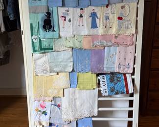 Large collection of vintage guest towels, some risqué