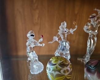 few examples of the many Swarovski crystal figurines, art glass paperweights