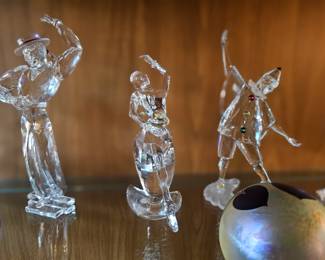 few examples of the many Swarovski crystal figurines, art glass paperweights