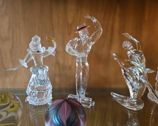 few examples of the many Swarovski crystal figurines, art glass paperweights