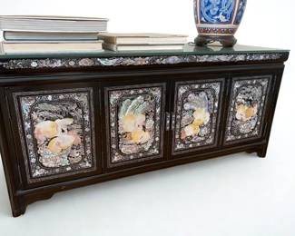 Lot 19: One or A Pair of Asian Black Lacquer Mother-of-Pearl Inlaid Chests. Two middle handles opens the interior storage space.
Custom made glass lays on top for protection. Two available. Width: 40" x Depth: 15 x Height 18.5 inches