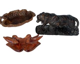 Lot 43: A Collection of 3 Wood Carved Articles, Tiger, Pair of Ducks and Dish.
Tiger: Width 10.5 x Height 6 x Depth 3.5 inches. Pair of Ducks: Width 10 x Depth 6 x Height 2 inches Dish: Width 8 x Depth 3.5 x Height 4 inches. CONDITION: Small chip on dish at tail. Scratches on ducks.