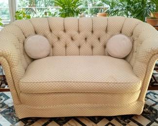 Lot 15: A Yellow Patterned Upholstered Loveseat with tufted back, rolled arms, straight skirt.
CONDITION: Solid piece. Stain on seat and front.