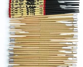 Lot 65: A Set of 24 Wood Chopsticks Total.