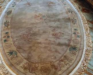 Lot 24: Neutral Oval Rug with Fringe. Purchase in Hong Kong.
