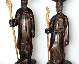 Lot 42: A Pair of Asian Wood Carved Figurines of Man and Lady Height 8.5 x Width 2.25 inches