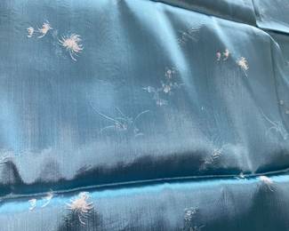 LOT 54: An Asian blue with light design silk fabric. 70 x 29 inches.