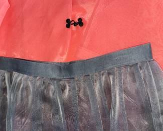 Lot 44: A Set of Korean Ladies Jacket and Skirt. Orange jacket with gray v-neck trip and black closures. Gray pleated skirt to match jacket trim. Jacket: Length: 22.5 x Waist: 18.5 x Underarms: 19
inches Skirt: Waist 18 x Length 33 x Hips 52 inches
In good condition.
