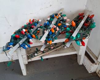 Several White Wooden Benches and Christmas Lights too!