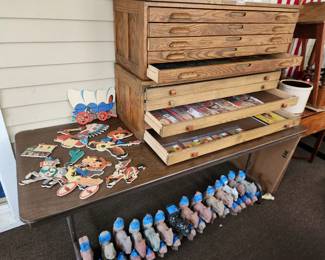 Two stack-able Hamilton of Twin Rivers Wisconsin 5 drawer cabinets. $750 each. 1950's school classroom character hangers $60 set. Cement squirrel and bunnies. Squirrels $10 each. Bunnies $5 each.