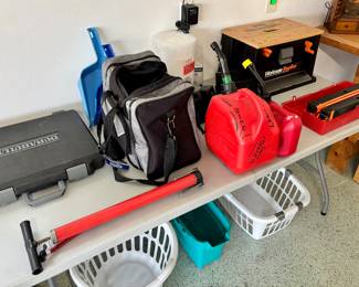 Tools, gas cans and a bowling ball. Man cave material.