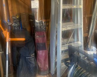 Golf clubs, ladders , hose stand