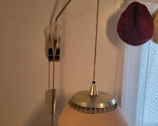 MOE...MOE...MOE Lighting was one of the premier American mid-century modern and atomic lighting manufacturers of the 50's and 60's. MOE's Cordette Series came out in about 1958 and featured designs with brass wire wrapped in hardened Danish cord.  Mid Mod Collective currently has two MOE fixtures in stock from the Cordette series. We have a Wall Sconce and the matching, pretty rare Adjustable Height Wall-Mounted Lamp.  This lamp features a 3-way switch and heavy brass counterweight which raises and lowers the light and shade.  Way cool! Two Available. 