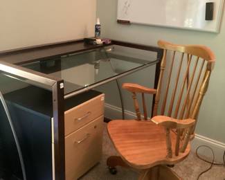 Glass top desk, file cabinet with drawer, wooden desk chair, dry erase board