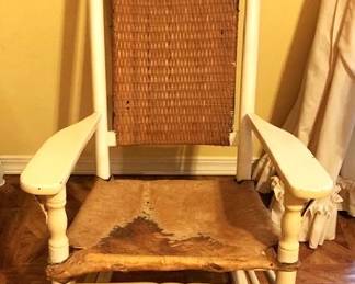 Vintage white rocker with cowhide bottom