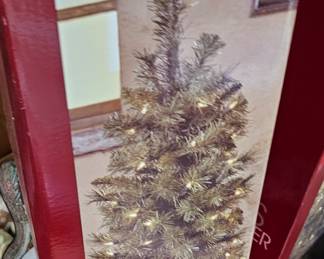 several Christmas trees in different sizes