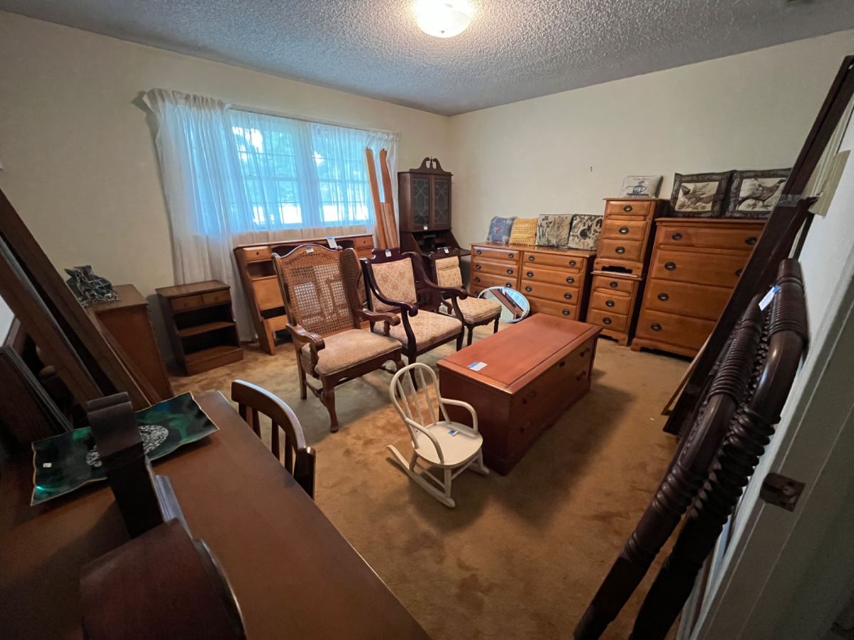 Spainhour solid maple bedroom set with full-size bed, dresser, chest, 2 nightstands, mirror (shown on back top of picture)--Other items in room are multiple antique chairs and cedar chest