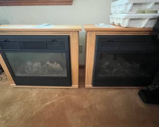 Two Heat Surge electric fireplace space heaters with remote control