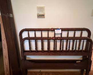 Antique mahogany Jenny Lind double bed with headboard, footboard, and slats