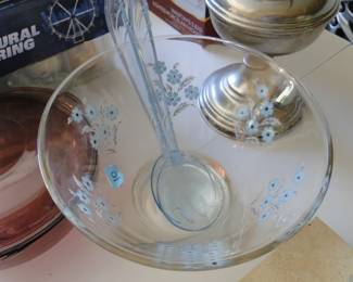 Beautiful floral salad bowl with serving utensils
