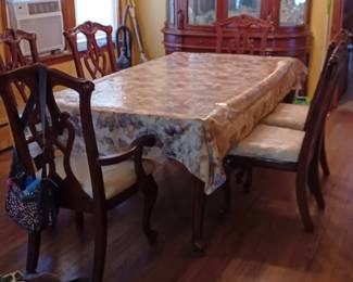 Table, China cabinet and 6 matching chairs. Hardly used